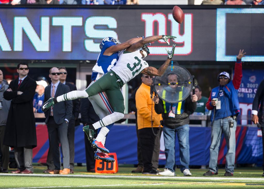  Cornerback Antonio Cromartie #31 of the New York Jets can not complete a pass during the first quarter as the New York Giants play the New York Jets at MetLife Stadium. December 6, 2015