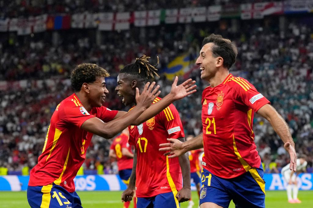 Spain's Nico Williams, center, celebrates with teammates after winning the Euro 2024.