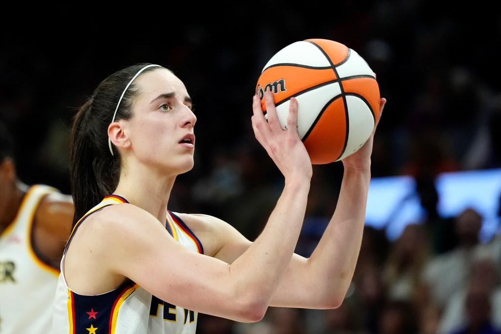 Indiana Fever guard Caitlin Clark preparing a technical foul shot during a WNBA game against the Phoenix Mercury