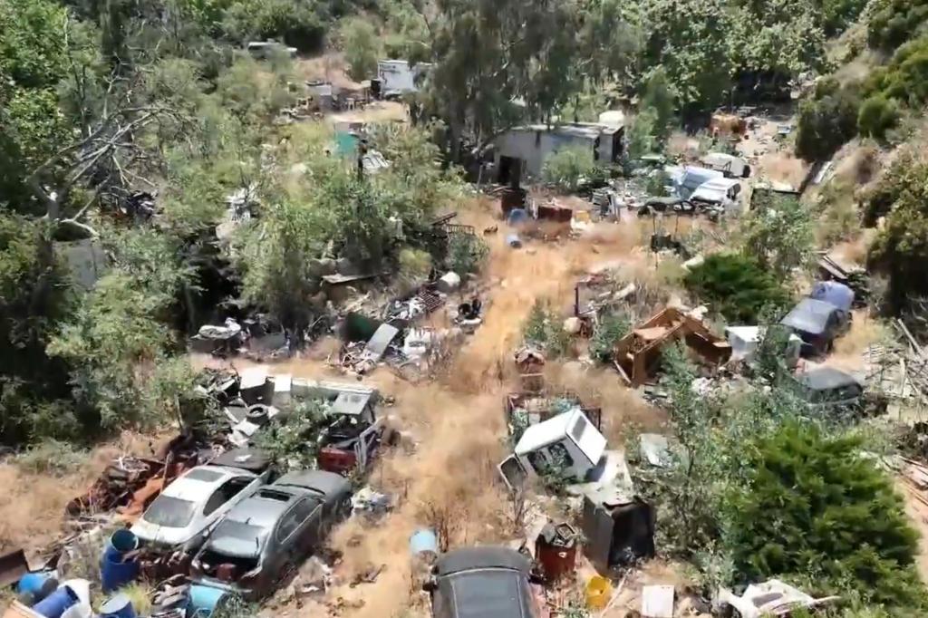 An aerial video of the property taken by KTLA shows how cluttered her neighbors property has gotten over the years.