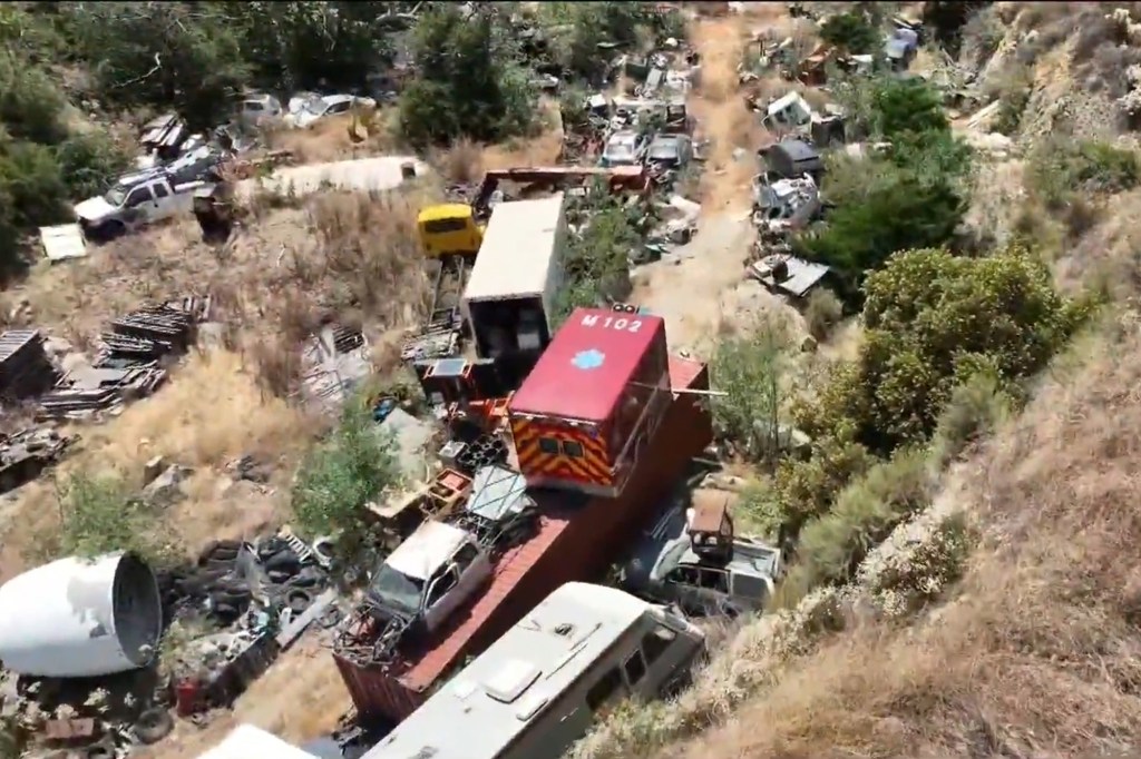 The property is owned by Mary Ferrera, whose son David Ferrera lives at the makeshift junkyard.