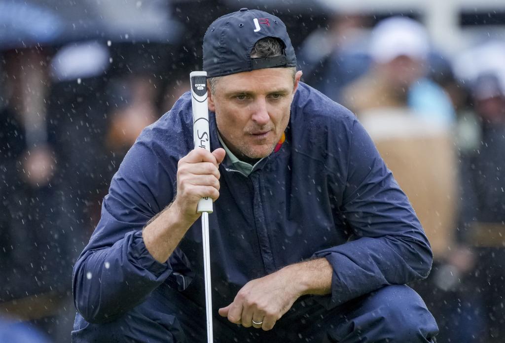 Justin Rose lines up a putt during the third round of the British Open. 
