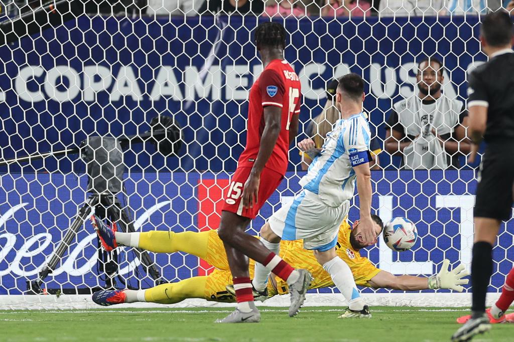 Lionel Messi scores a second-half goal during Argentina's win.