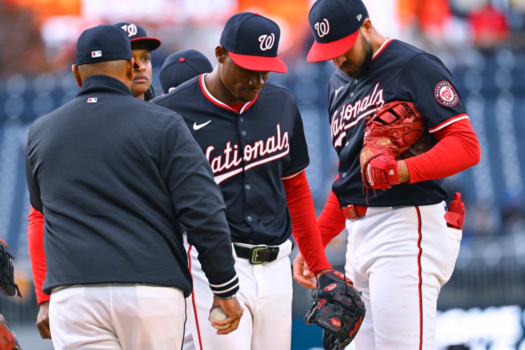 Washington Nationals starting pitcher Josiah Gray, center, leaves during the fifth inning of a baseball game against the Pittsburgh Pirates at Nationals Park, Thursday, April 4, 2024, in Washington.