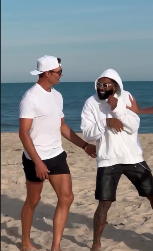 Tom Brady playing football on the beach in the Hamptons