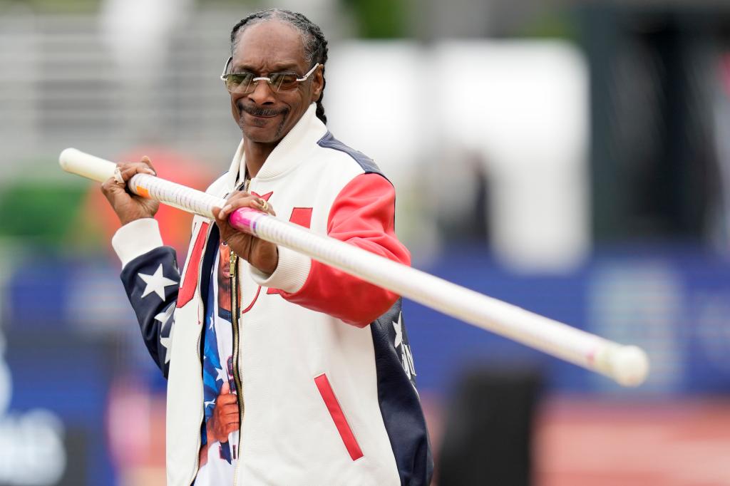 Snoop Dogg gets a pole vaulting lesson during the U.S. Track and Field Olympic Team Trials last month.