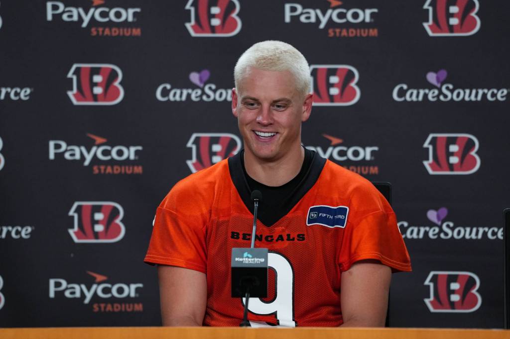 Joe Burrow explaining his new hairstyle at training camp press conference.