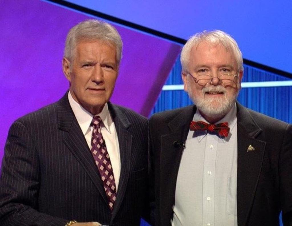 Brendan DuBois -- posing with late host Alex Trebek -- is a former "Jeopardy!" game show champion.