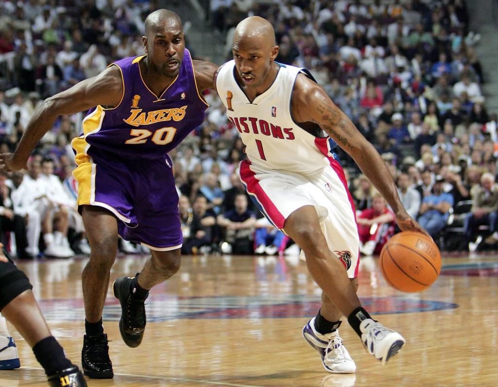 Chauncey Billups #1 of the Detroit Pistons attempts to dribble around Gary Payton #20 of the Los Angeles Lakers during the third quarter of game three of the 2004 NBA Finals June 10, 2004 at The Palace of Auburn Hills in Auburn Hills, Michigan.  