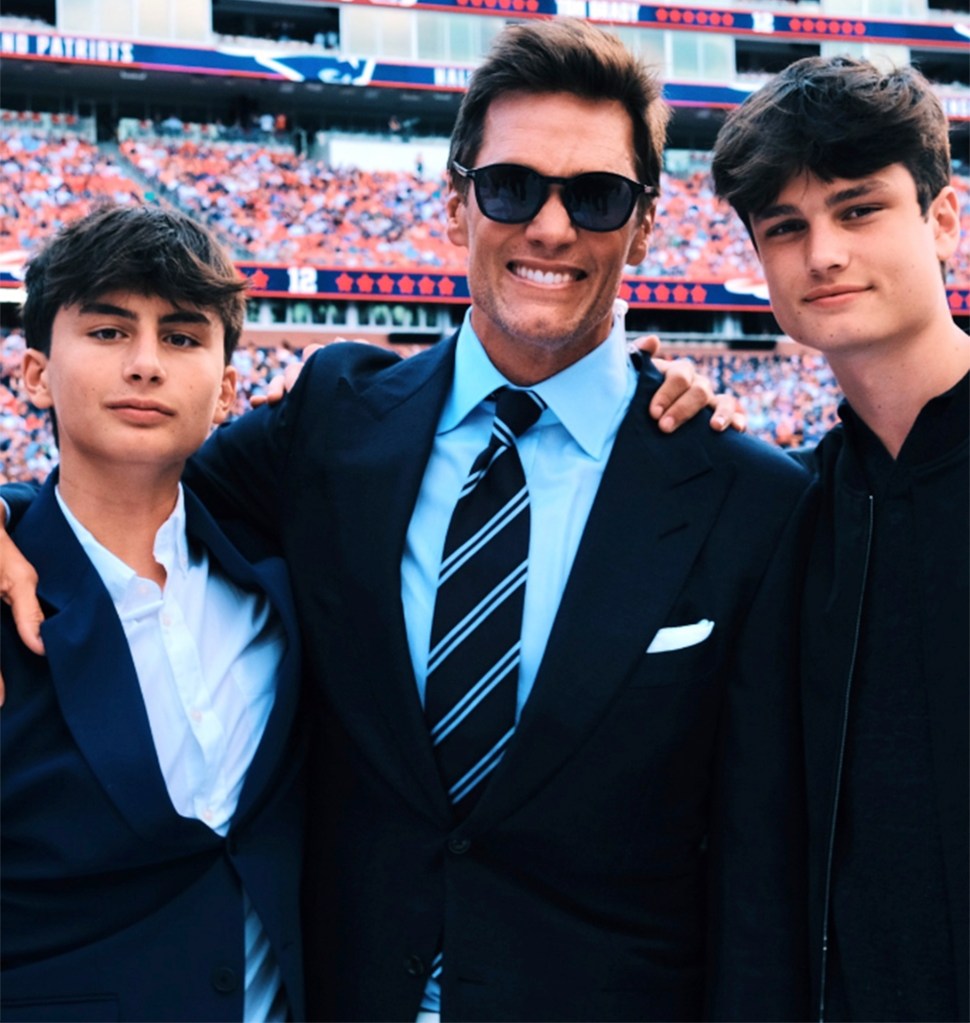 Tom Brady with sons Benjamin and Jack during his induction into the Patriots' Hall of Fame in June 2024.