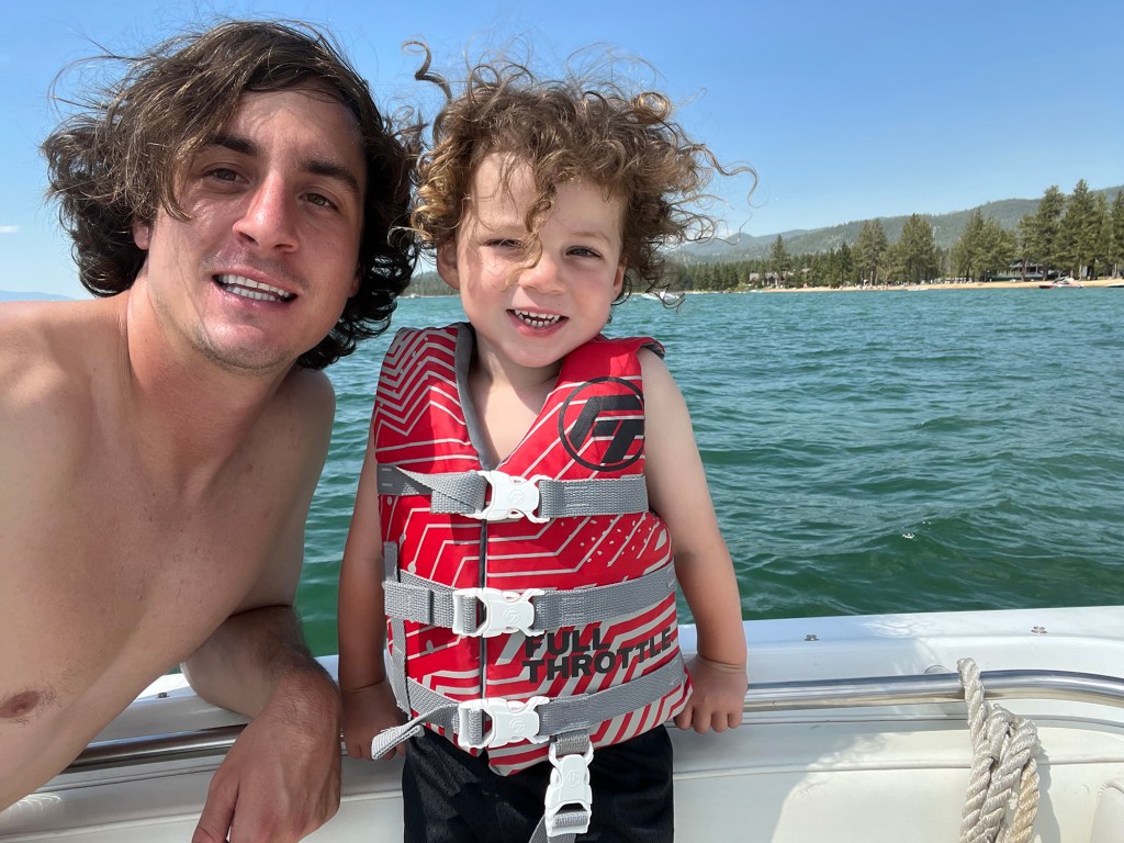 Harrison Tinsley with his 4-year-old son Sawyer on a boat.