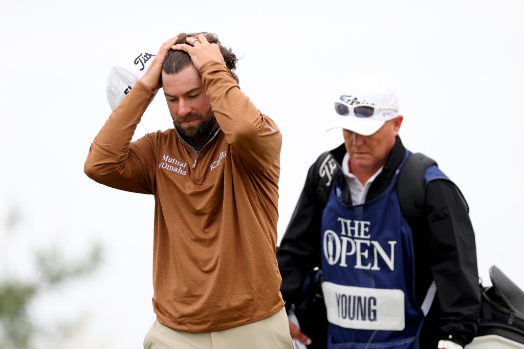 Cameron Young of the United States and his caddie Steve Underwood walk on the first hole during day three of The 152nd Open championship at Royal Troon on July 20, 2024 in Troon, Scotland.