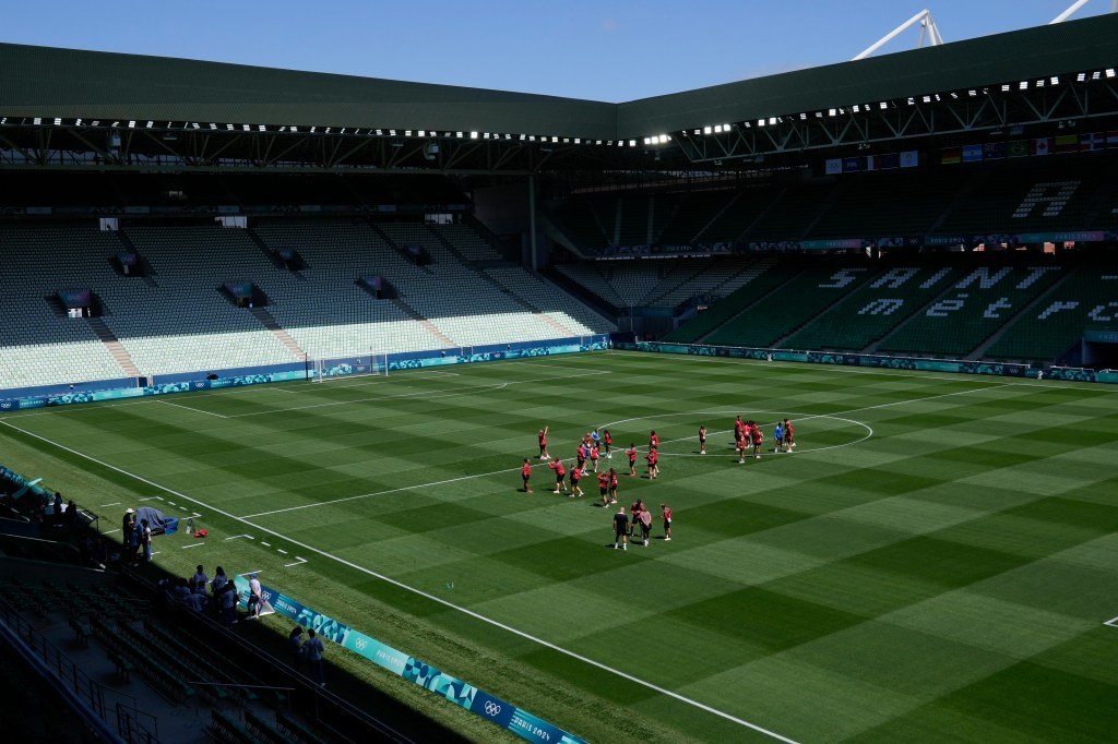  A Canadian women's soccer staffer was caught flying a drone over New Zealand's  \Olympic practice.