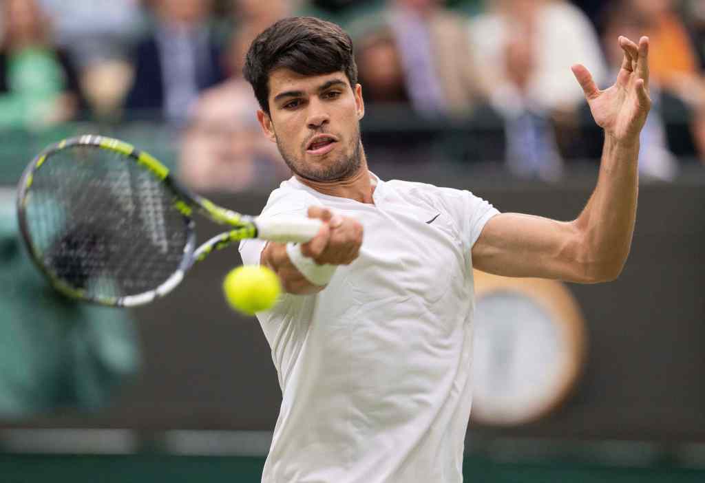 Carlos Alcaraz of Spain returns a shot against Tommy Paul of the United States (not shown) during a match on day nine of The Championships at All England Lawn Tennis and Croquet Club. 