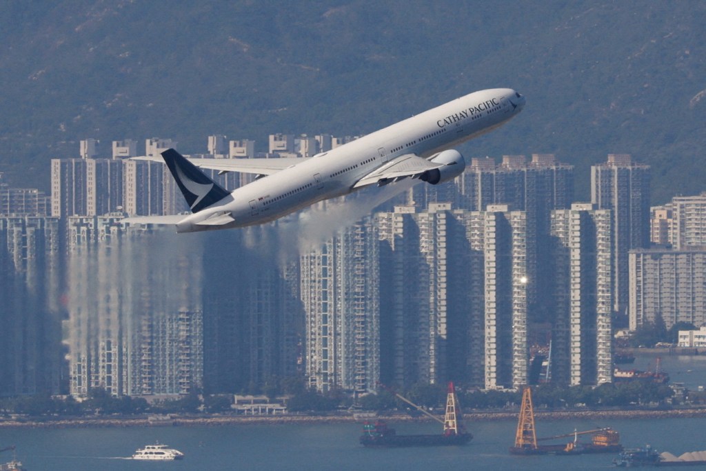 A Cathay Pacific aircraft takes off at the airport