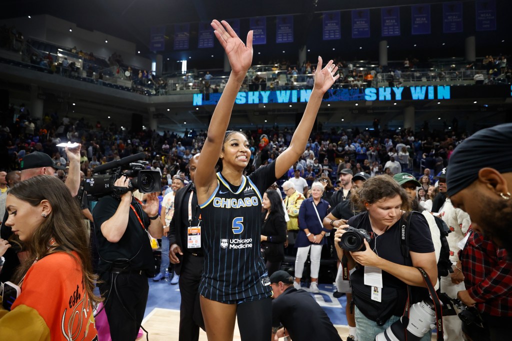 Chicago Sky forward Angel Reese celebrating her victory in basketball game against Indiana Fever at Wintrust Arena