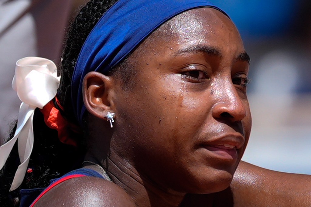 Coco Gauff cries after an argument with an umpire during her Olympics loss on July 30, 2024.