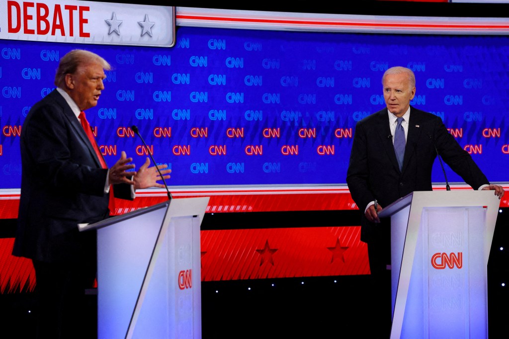 President Biden listens as Republican foe Donald Trump speaks during their debate in Atlanta, Ga., on June 27. 