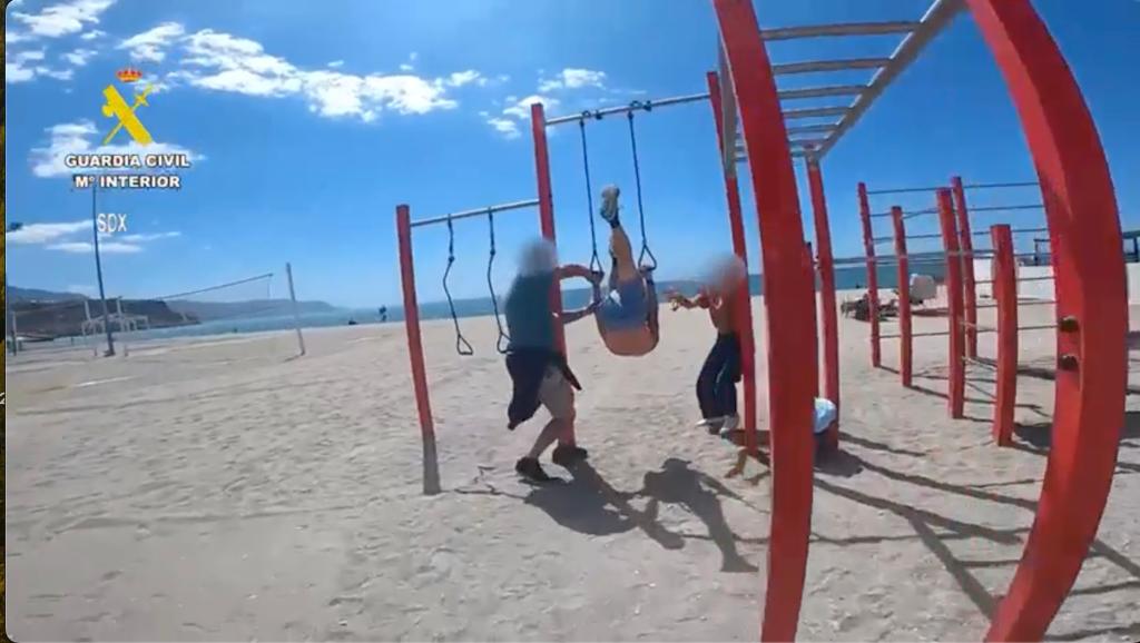 Clacher was approached by police while he was hanging upside down on a Costa del Sol beach.