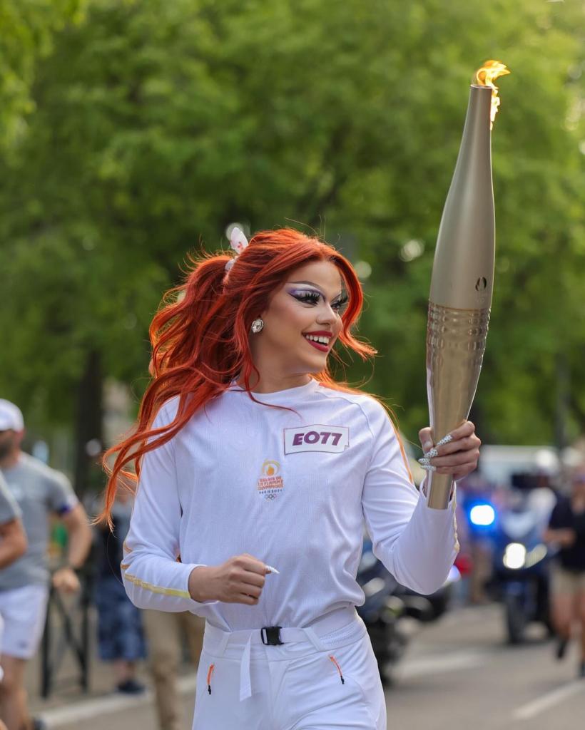 Nicky Doll carrying the Olympic torch for Paris 2024 Olympics