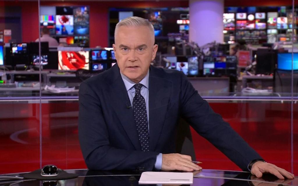 Huw Edwards, former BBC presenter, sitting at a desk