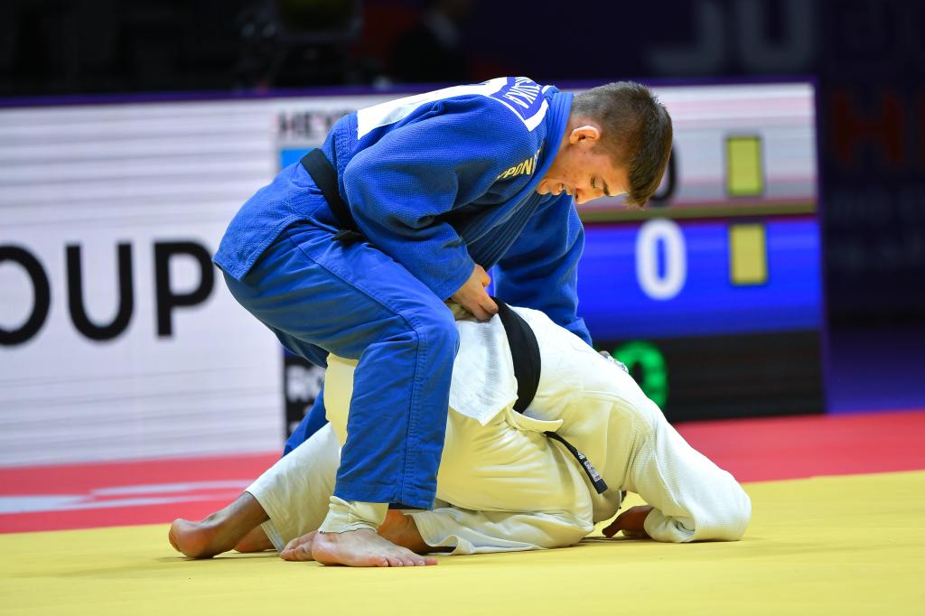 Jack Yonezuka of USA competing against Hidayat Heydarov of Azerbaijan in the -73 kg category at the World Judo Championships 2023 in Doha, Qatar