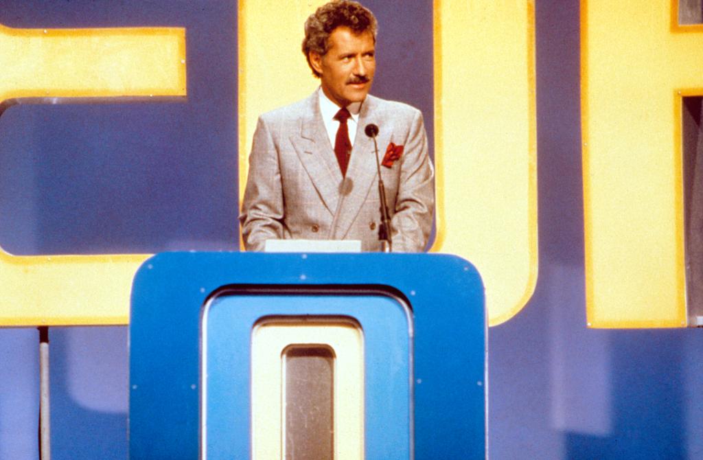 A young Trebek hosting "Jeopardy!" in 1984.