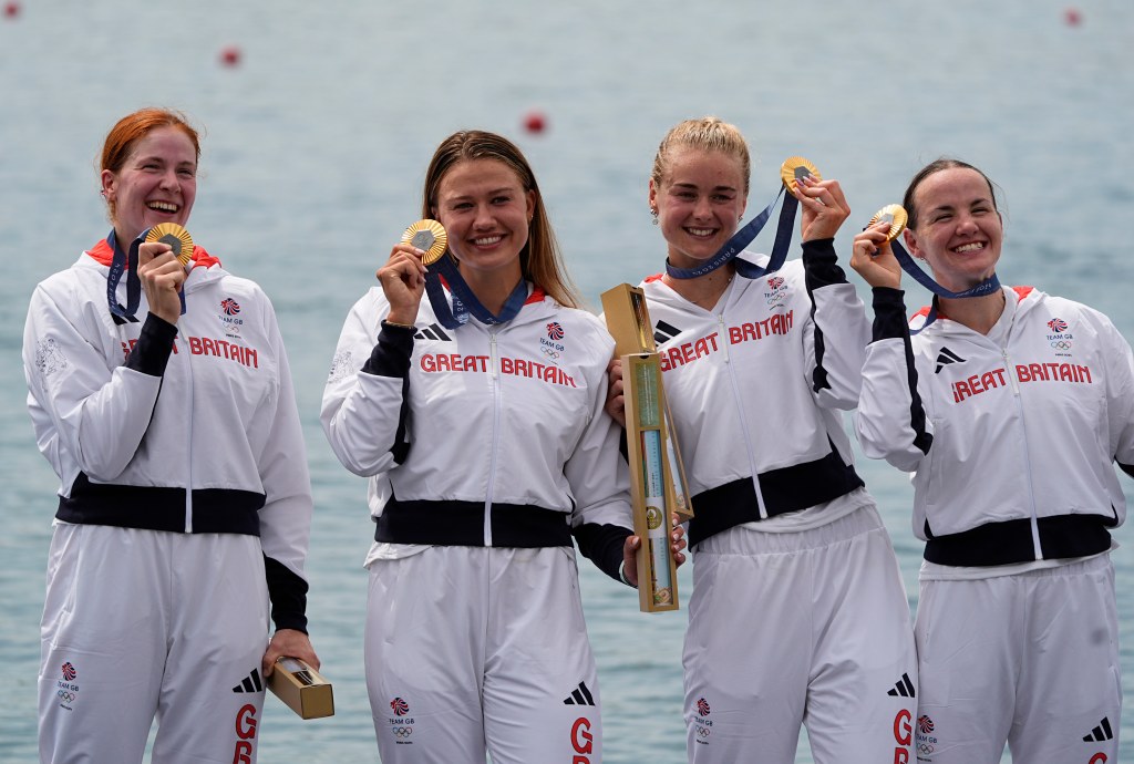 Lauren Henry, Hannah Scott, Lola Anderson and Georgina Brayshaw (GBR) celebrate their gold medal in women's quadruple sculls during the Paris 2024 Olympic Summer Games at Vaires-sur-Marne Nautical Stadium.