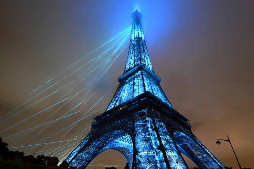 Lights illuminate the Eiffel Tower.