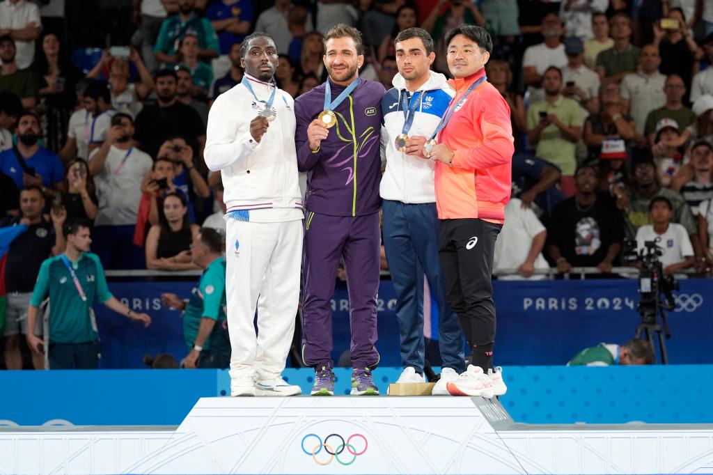 Medal winners on the podium at the 2024 Paris Olympics men's Judo -73kg event, from left Joan-Benjamin Gaba of France with silver, Hidayet Heydarov of Azerbaijan with gold, and Soichi Hashimoto of Japan and Adil Osmanov of Moldova with bronze.