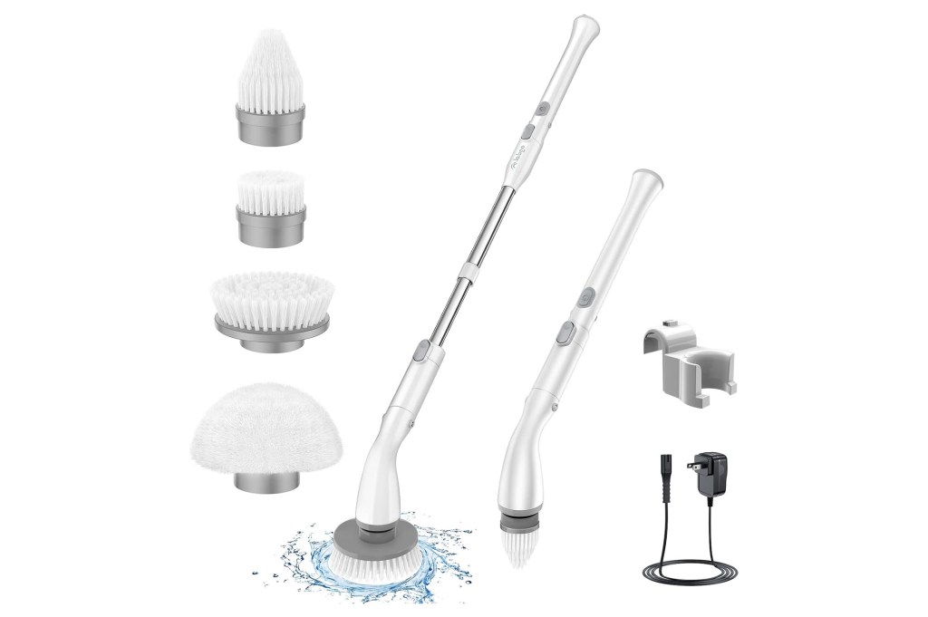 A group of white objects with handles, likely mops