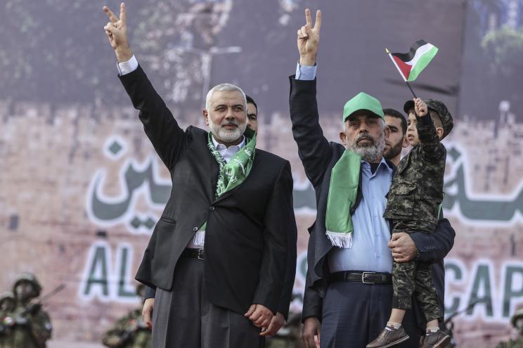 The head of the Hamas political bureau, Ismail Haniyeh (L), and Hamas leader in the Gaza Strip, Yahya Sinwar, flash the victory sign a rally marking the 30th anniversary of Hamas in Gaza City, Gaza, 14 December 2017