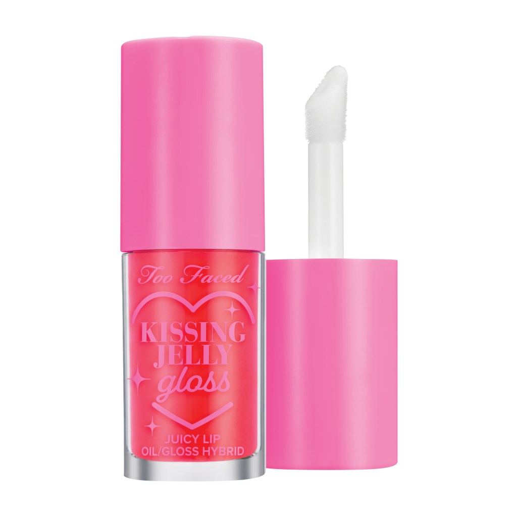 A pink lip gloss labeled as Kissing Jelly Lip Oil Gloss in Sour Watermelon from TooFaced.com with a white lip brush