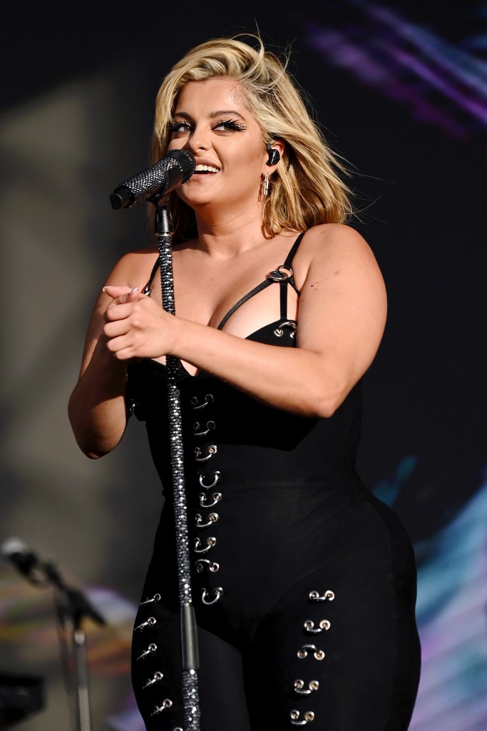 Popstar Bebe Rexha performing onstage at Pride In London 2024, Trafalgar Square Stage, singing into a microphone.