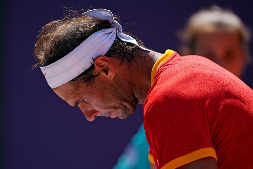 Rafael Nadal plays against Novak Djokovic in the men's tennis singles first round match during the 2024 summer Olympics.