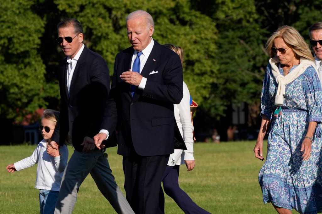 President Joe Biden, center, arrives with grandson Beau Biden, from left, son Hunter Biden and first lady Jill Biden at Fort Lesley J. McNair, Monday, July 1, 2024, in Washington, on return from Camp David.