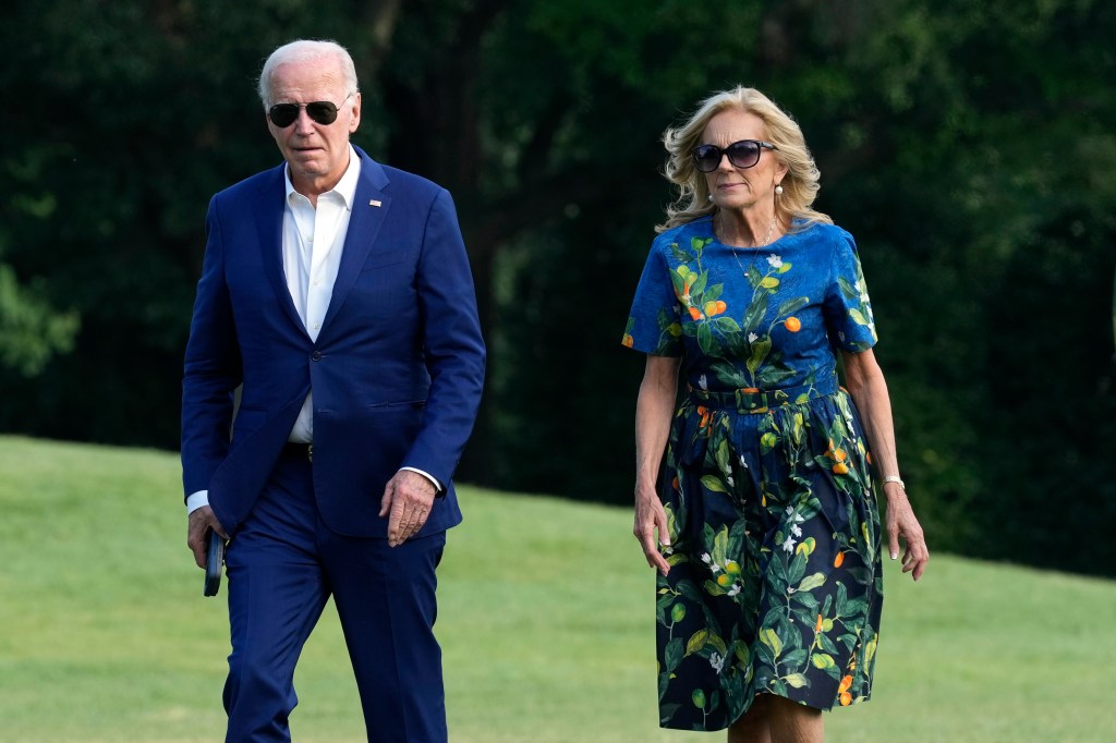 President Joe Biden is seen left with First Lady Jill Biden. The president is refusing calls to step aside.