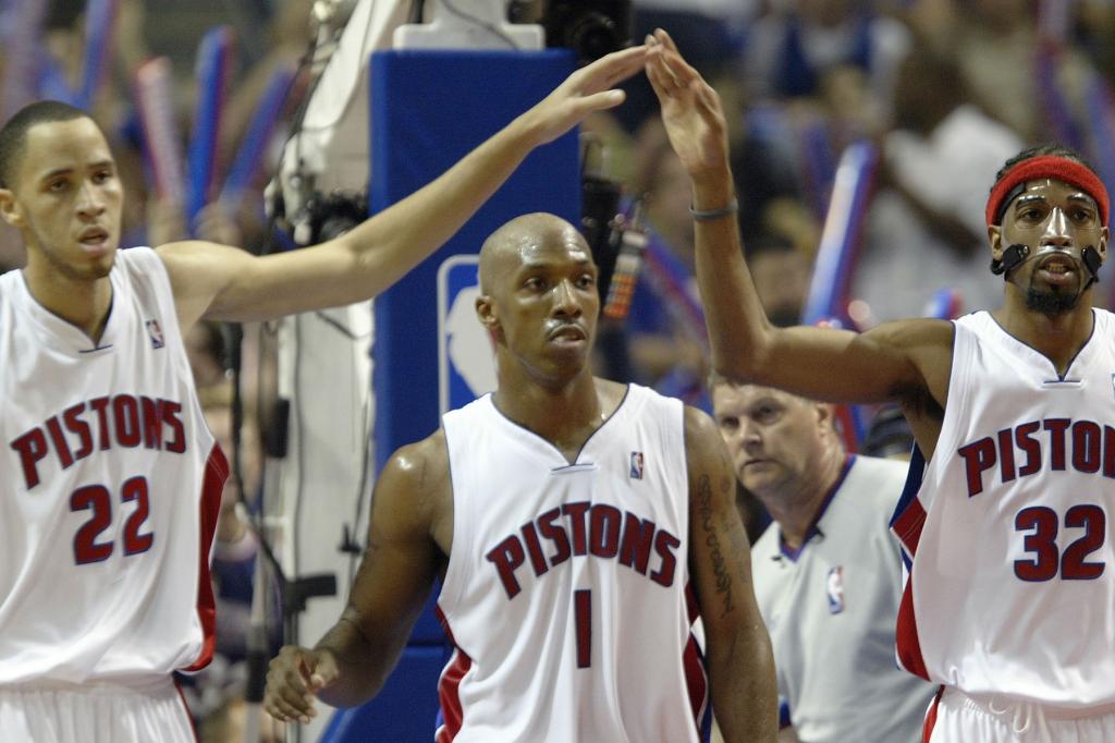 Tayshaun Prince #22, Chauncey Billups #1 and Richard Hamilton #32 of the Detroit Pistons walk up court against the Miami Heat in Game Six of the Eastern Conference Finals during the 2005 NBA Playoffs June 4, 2005 at the Palace At Auburn Hills in Auburn Hills, Michigann