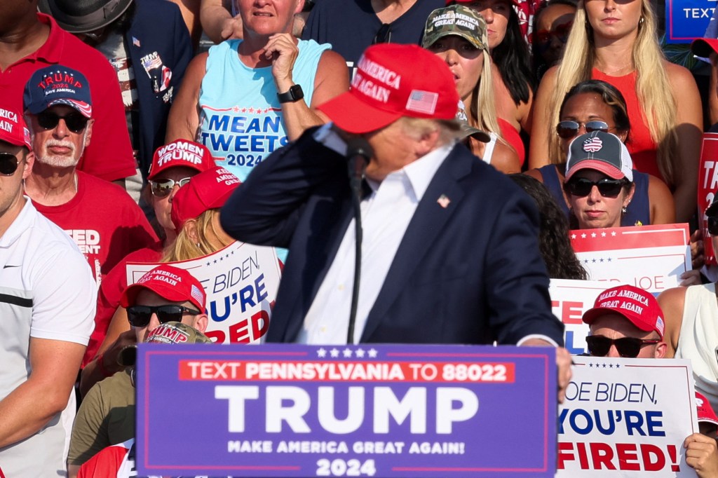 Republican presidential candidate and former U.S. President Donald Trump reacts as multiple shots rang out during a campaign rally at the Butler Farm Show in Butler, Pennsylvania, U.S., July 13, 2024. 