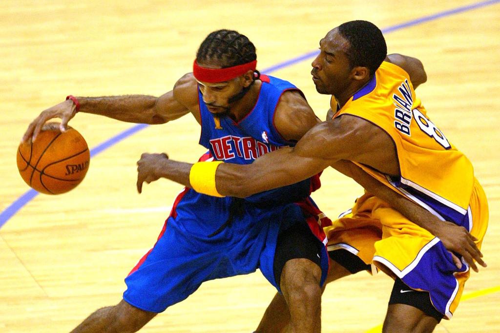 Richard Hamilton #32 of the Detroit Pistons handles the ball under pressure from Kobe Bryant #8 of the Los Angeles Lakers in Game 2 of the 2004 NBA Finals on June 8, 2004 at Staples Center in Los Angeles, California.