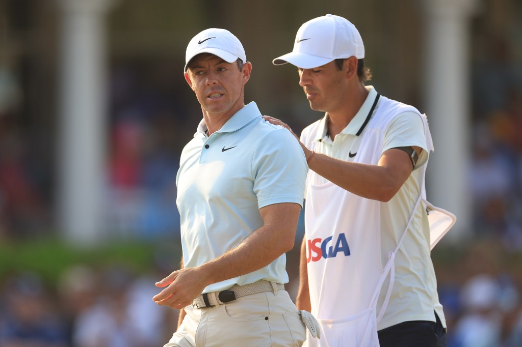 Rory McIlroy being consoled by his caddie, Harry Diamond, after making a bogey at the 18th hole during the U.S. Open final round