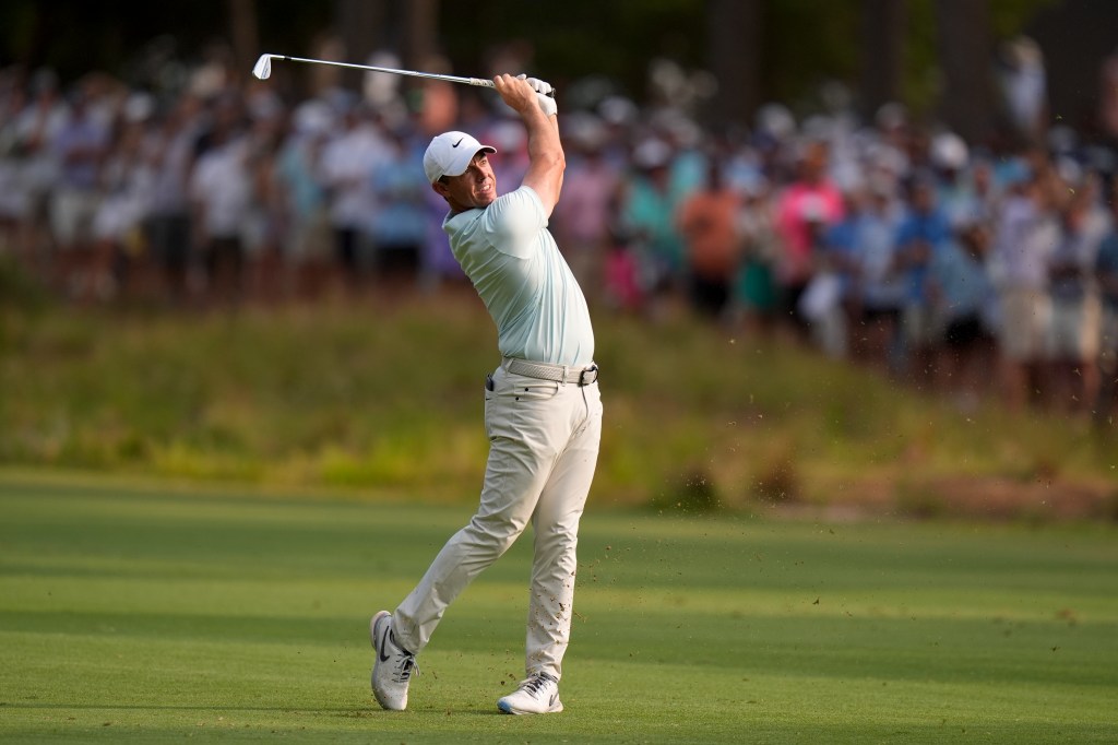 Rory McIlroy, of Northern Ireland, hits from the fairway on the 16th hole during the final round of the U.S. Open golf tournament Sunday, June 16, 2024, in Pinehurst, N.C. 