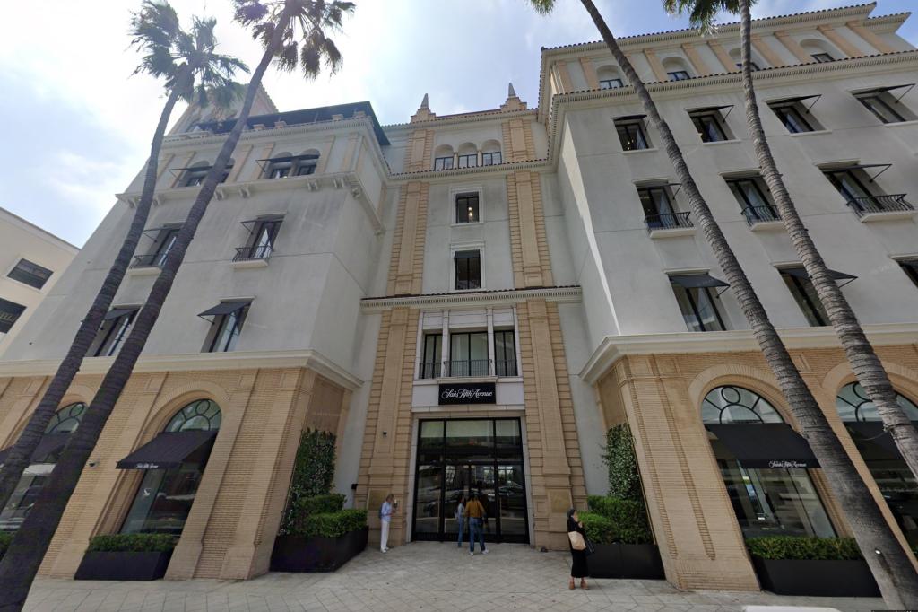 New Saks Fifth Avenue women's store located at 9570 Wilshire Blvd in Beverly Hills, previously a Barneys department store, surrounded by palm trees