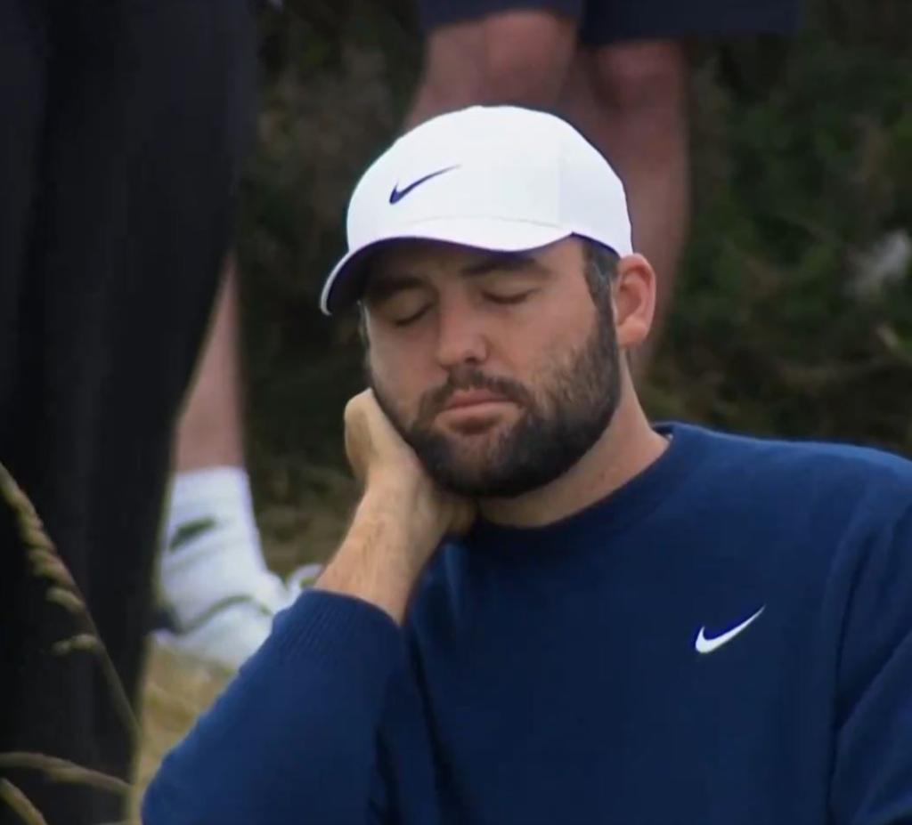 Scottie Scheffler reacts to three-putting the ninth hole.