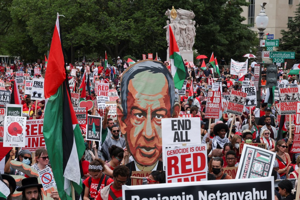 Pro-Palestinian demonstrators display signs against Israeli Prime Minister Benjamin Netanyahu and the war in Gaza, on the day he addresses a joint meeting of Congress, on Capitol Hill, in Washington, U.S., July 24, 2024.