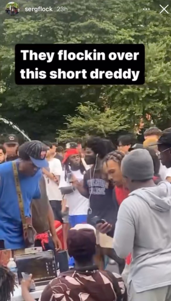 Screenshot from an Instagram post by @sergflock showing Twitch streamer Kai Cent being followed by fans in Washington Square Park.