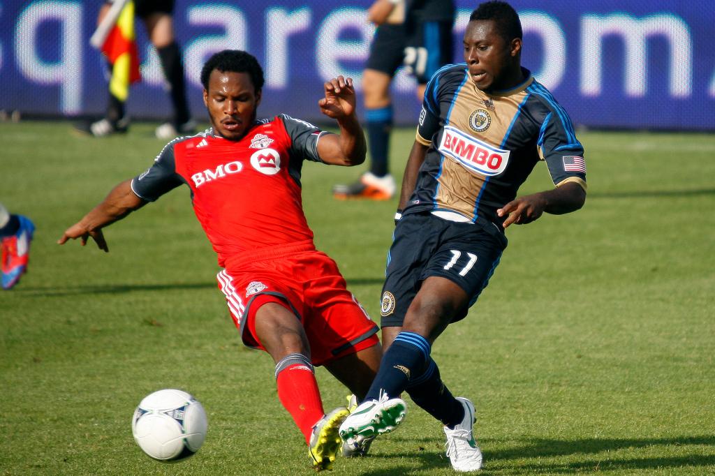 Julian de Guzman (l.), pictured in 2012 with Toronto FC, is now the sporting director with the Red Bulls.