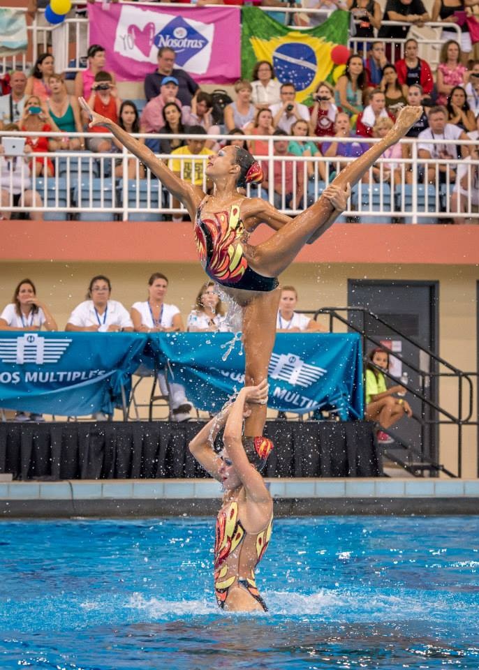 A group of women performing a stand lift in a swimming pool