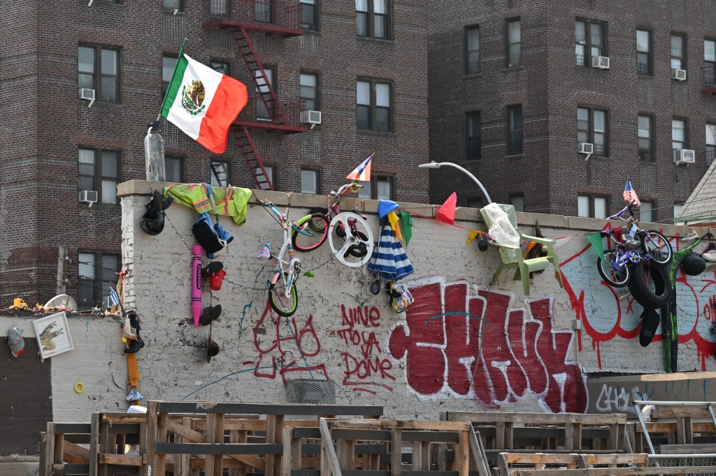 The occupants have festooned the walls and ramparts with a bizarre menagerie of flags, clothes, toys and other things. 