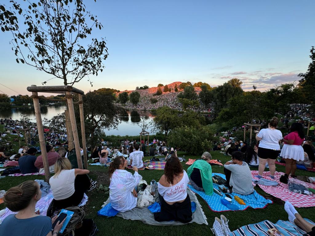 Thousands of Swift fans gather near concert venue to listen to her performance at the Olympiaberg